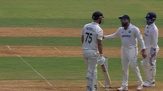 Conflict on the field: Rohit Sharma steps in as Sarfaraz Khan and Daryl Mitchell's clash escalates; chaos ensues moments later