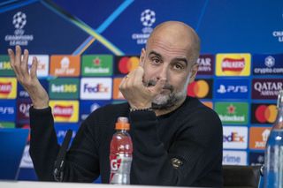 What caused Pep Guardiola to have scratches on his face?