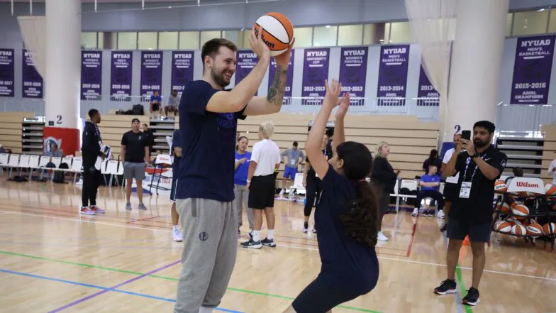 Luka Dončić establishing a foundation to mentor children in basketball within a positive setting